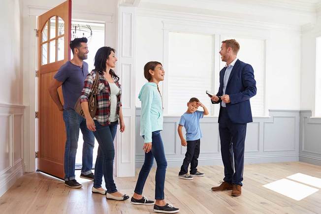 Desktop realtor showing family house