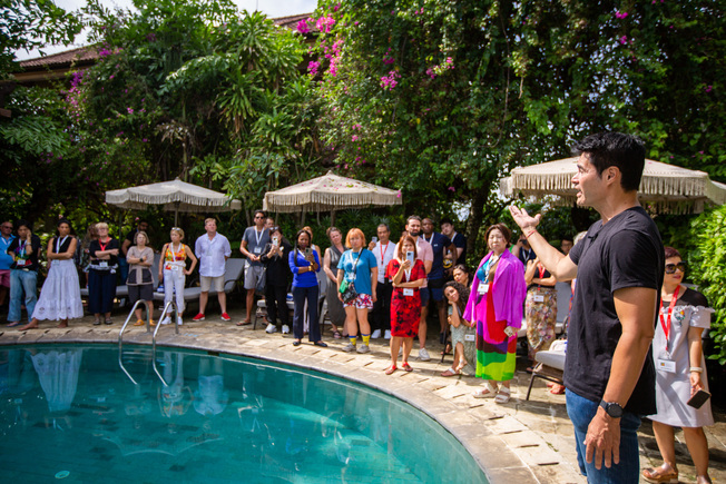 Desktop roger sharing wisdom by the pool at vision villa resorts bali
